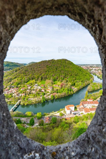 View of the Doubs River and the town of Besancon through a circular window in the World Heritage Site of Besancon Citadel