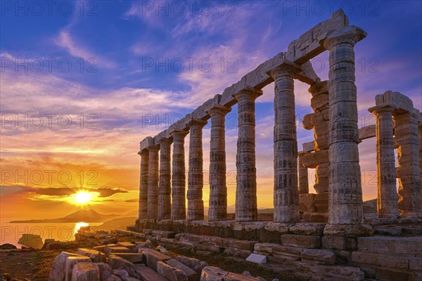 Beautiful sunset sky and ancient ruins of temple of Poseidon