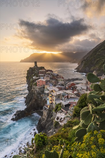 View of the colourful houses of Vernazza at sunset