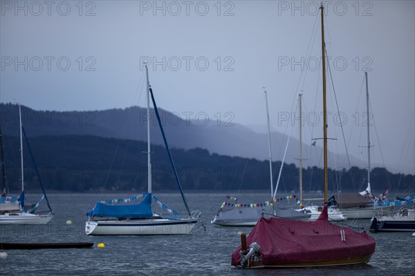 Light thunderstorm with rain shower with sailing boats