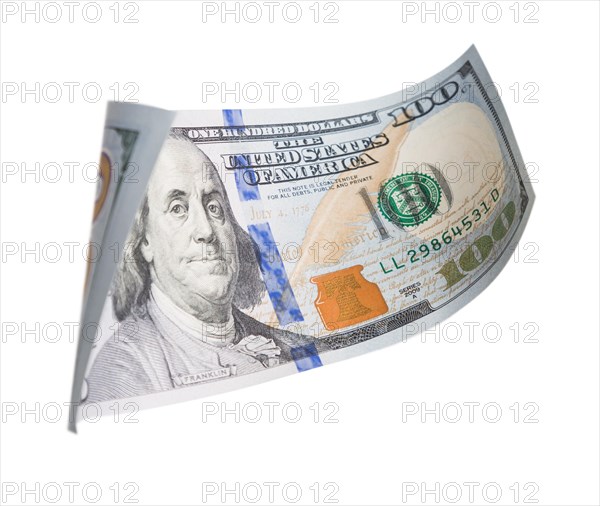 One hundred dollar bill falling or floating on empty background