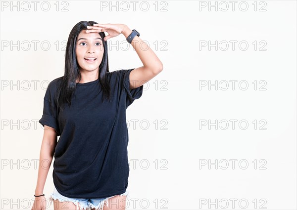 Astonished girl looking into the distance isolated. Surprised young girl looking into the distance isolated