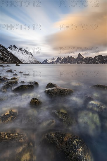 Snowy mountains by the fjord