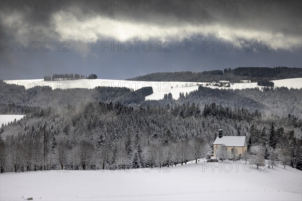 Fresh snow in November with a view of the Ohmen Chapel