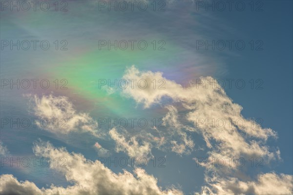 Quite rare optical phenomenon of iridescence of clouds of pearly