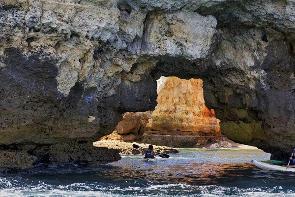 Tourists kayaking at Ponta da Piedade