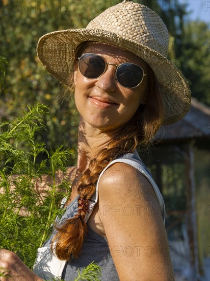 Woman in herb bed