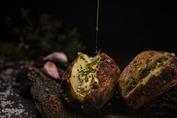 Rustic baked potatoes close up