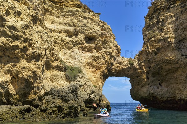 Tourists kayaking at Ponta da Piedade