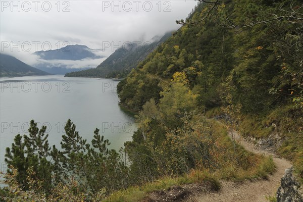 Hiking trail at the Achensee and view to the Achensee boat trip