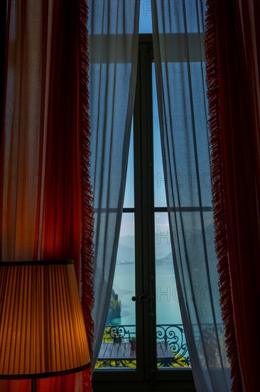 Window View from The Historical Grandhotel Giessbach with View over Mountain and Lake Brienz with Sunlight in Giessbach