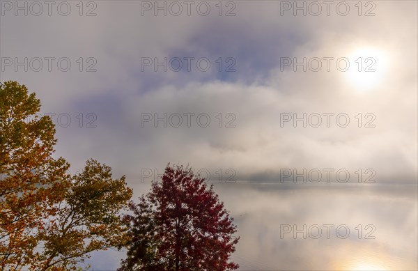 Cloudy Alpine Lake Lugano with Sunlight and Clouds on Surface Level in Lugano