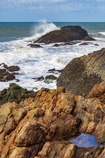 Waves crashing against the rocks in Serra Grande on the coast of the state of Bahia