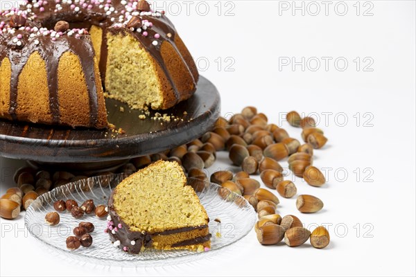 Vegan hazelnut cake on wooden serving plate