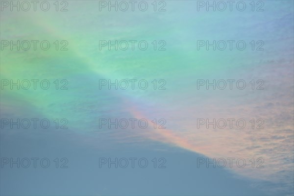 Quite rare optical phenomenon of iridescence of clouds of pearly