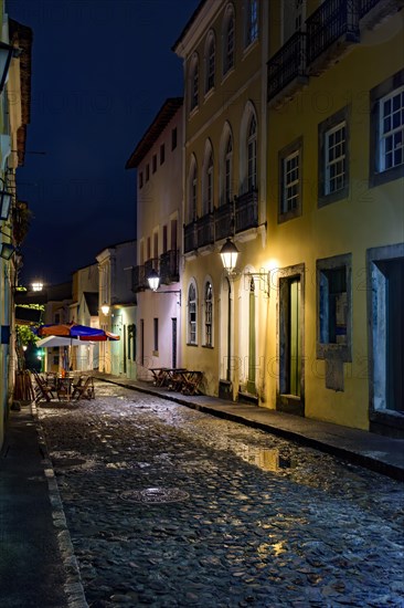 Pelourinho street in Salvador city at night with the facade of old houses illuminated by lanterns