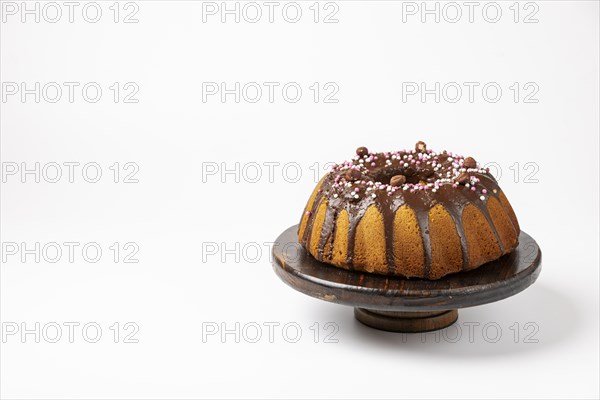 Vegan hazelnut cake on wooden serving plate