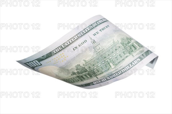 One hundred dollar bill falling or floating on empty background