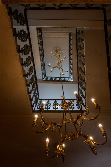 Beautiful Spiral Staircase with an Elegant Crystal Lamp in Switzerland