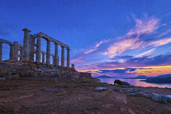 Beautiful sunset sky and ancient ruins of temple of Poseidon