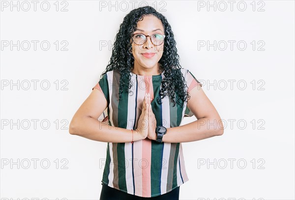 Young woman in glasses asking for a favor isolated. Latin girl asking for help with her hands isolated