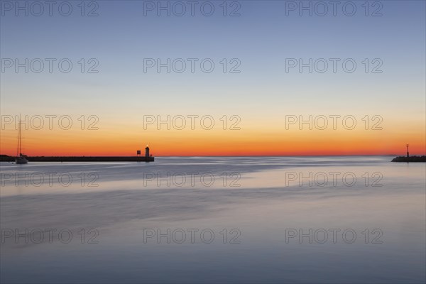 Sunset at the port entrance of Porec