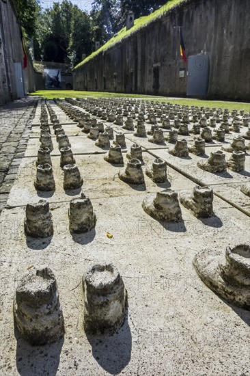 Pairs of boots remembering the soldiers who are still buried under the debris of the exploded Fort de Loncin