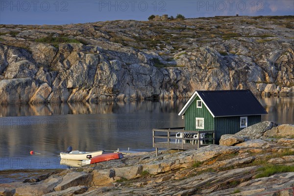 Wooden cottage in bay at Smoegen