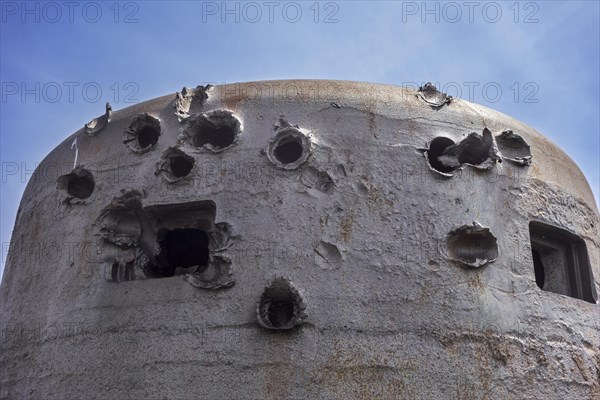 Battle-scarred World War Two 60 ton armoured bell of German coastal battery at D-Day Omaha Museum