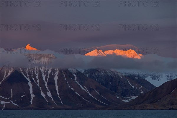 Mountains at sunset along the Hornsund fjord at Spitsbergen