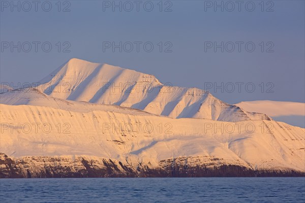 Snow covered mountains at Billefjorden at sunset