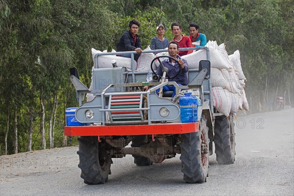 Primitive truck for transporting rice workers and bags of rice in the Tra Su Cajuput Forest