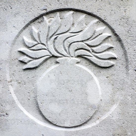 Grenadier guards regimental badge on headstone at Cemetery of the Commonwealth War Graves Commission for First World War One British soldiers