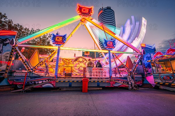 Ride at the Old Town Festival of Jena on the Eichplatz after sunset with the Jentower in the background