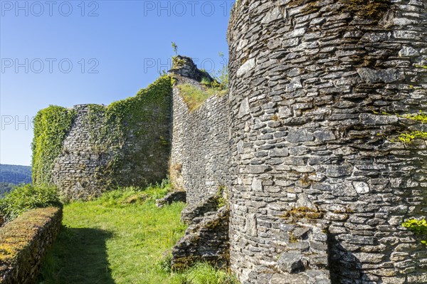 Buttresses on stone outer wall of 13th century Chateau d'Herbeumont