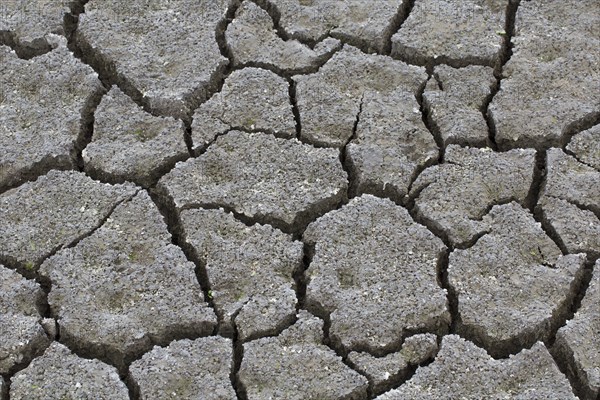 Abstract pattern of dry cracked clay mud in dried up lake bed