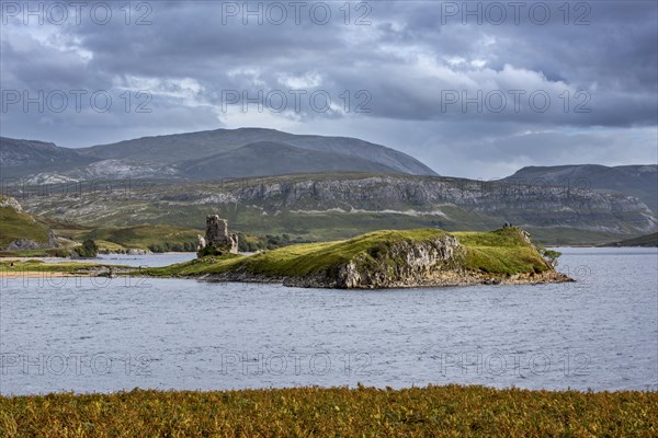 16th century Ardvreck Castle ruins at Loch Assynt in the Highlands at sunset