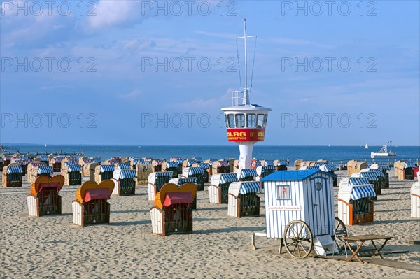 Roofed wicker beach chairs on the beach at Travemuende