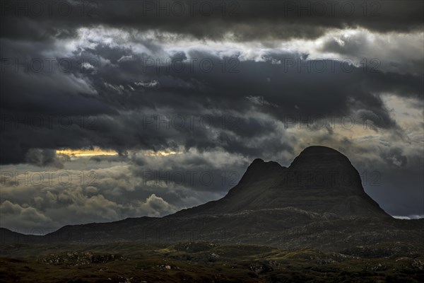 Storm clouds over the mountain Suilven at night