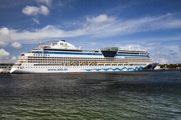 The cruise ship AIDADiva at the quay wall of the Warnemuende Cruise Center in the port of Rostock-Warnemuende