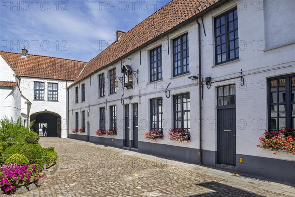 17th century white beguines' houses in courtyard of the Beguinage of Oudenaarde