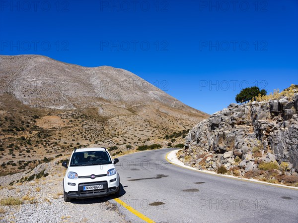 Car parked on mountain road at Psiloritis