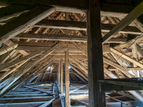 Village church roof truss made of wooden beams