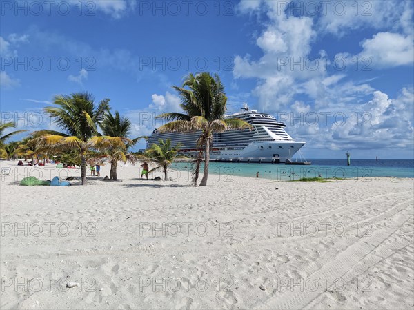 Lighthouse Bay and cruise ship MSC Seashore on the private island of the cruise line MSC Cruises