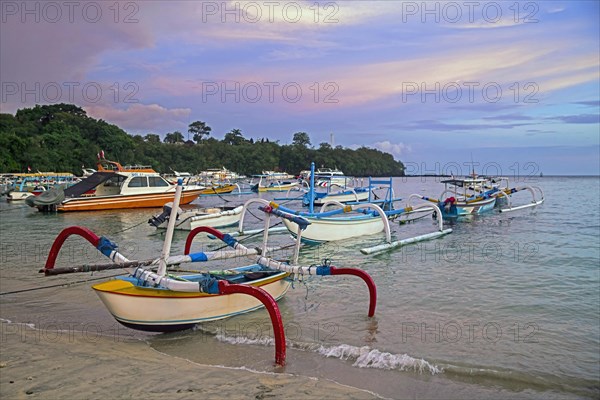 Traditional outrigger fishing boats on the beach at Padang Bai