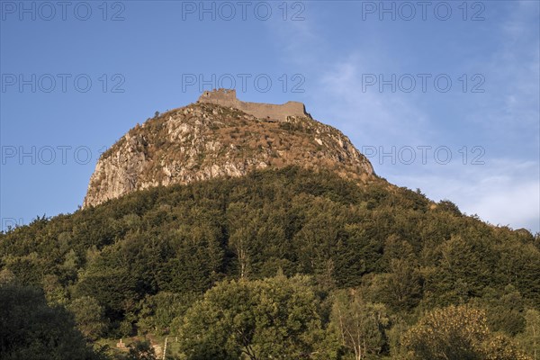 Ruins of the medieval Chateau de Montsegur castle on hilltop at sunset