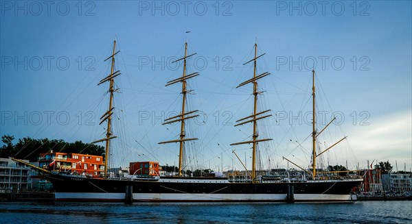 Museum sailing ship Passat in Priewall harbour at sunset