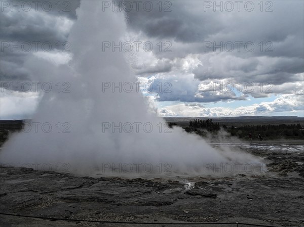 The geyser Stokkur in the hot water valley Haukadalur in the municipality of Blaskogabyggd in the south of Iceland