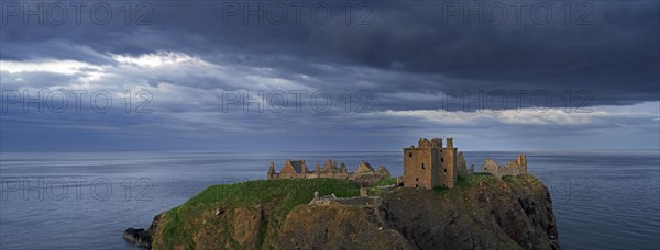 Menacing dark clouds above Dunnottar Castle