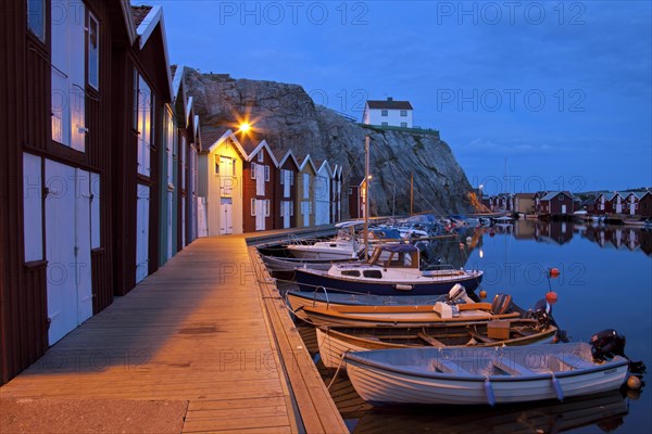 Wooden fishing huts in the village Smoegen